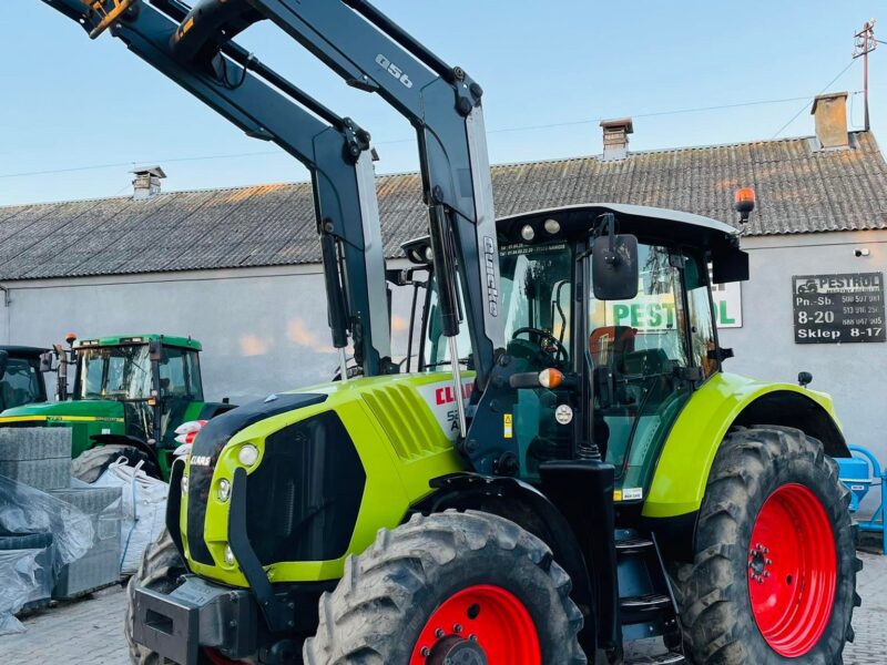 Claas Arion 520 z ładowaczem QUICKE Q56